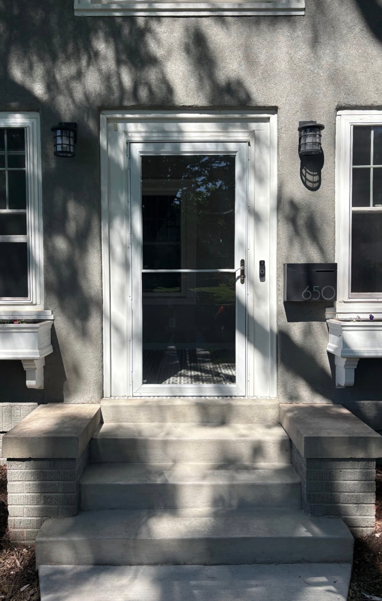 Front porch after concrete restoration and tile removal in Des Moines, IA